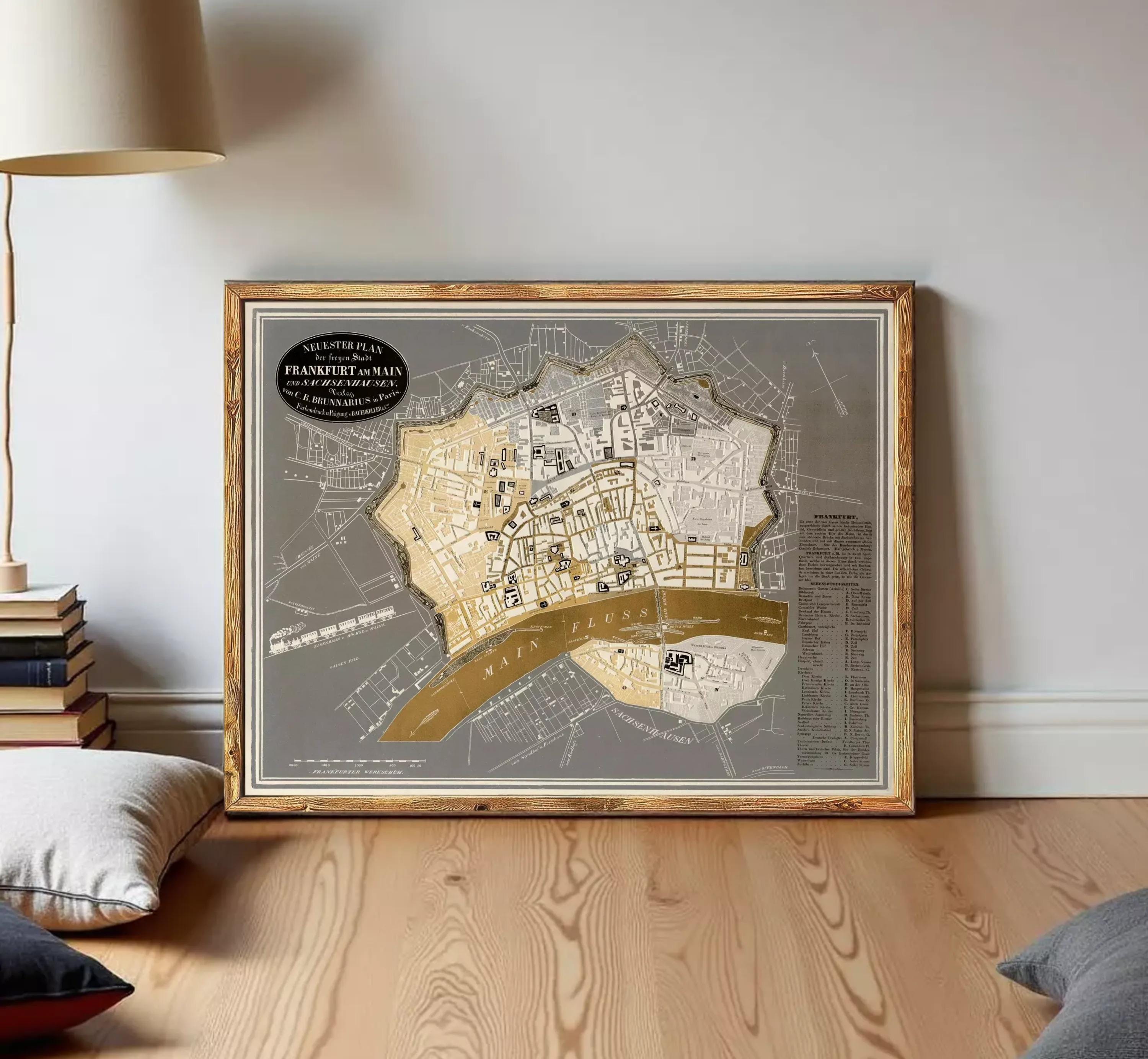 The image is a framed map of a city, likely a historical or geographical map, displayed on a white wall.