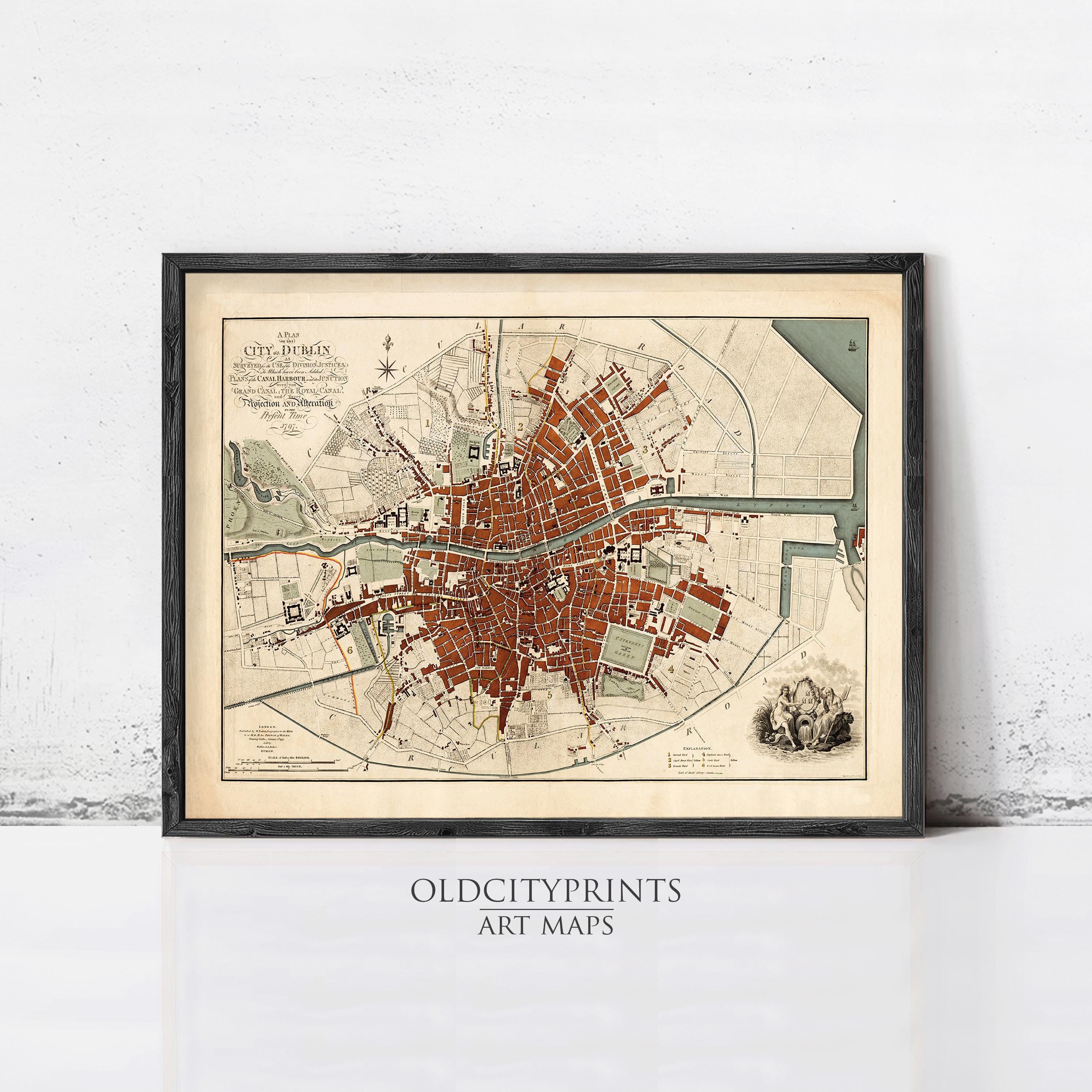 The image is a framed vintage map of a city, likely London, with a detailed and intricate layout of streets, landmarks, and other urban features.