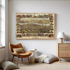 a large framed map of a city hanging on a wall in a living room.