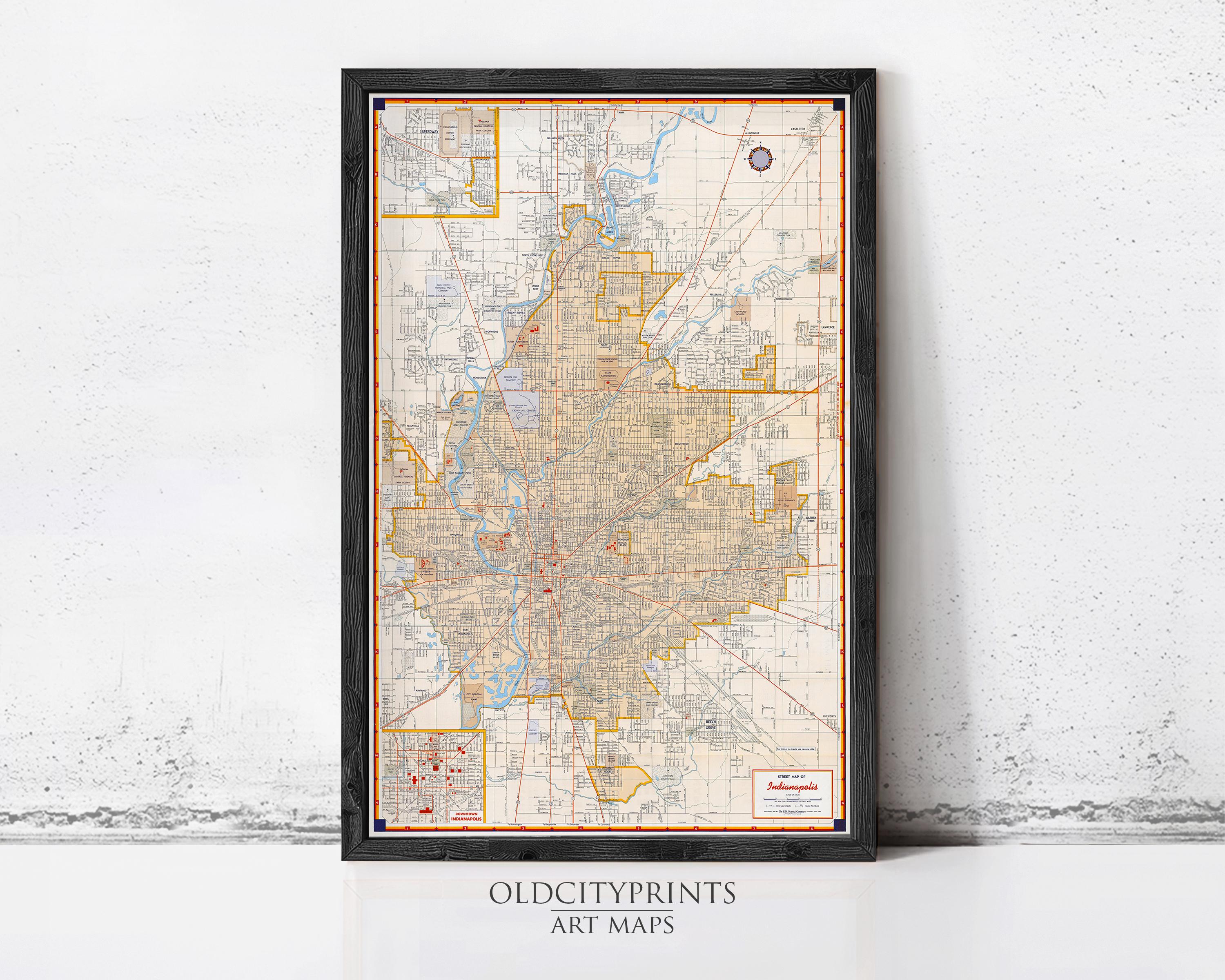 The image is a framed art print depicting a detailed map of a city or region, with various streets, neighborhoods, and landmarks clearly marked.