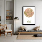 A framed map of a city, with a circular design and a map of the city displayed on it.