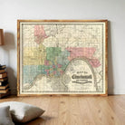 The image is a framed vintage map of Cincinnati, Ohio, showing the city's streets and neighborhoods.