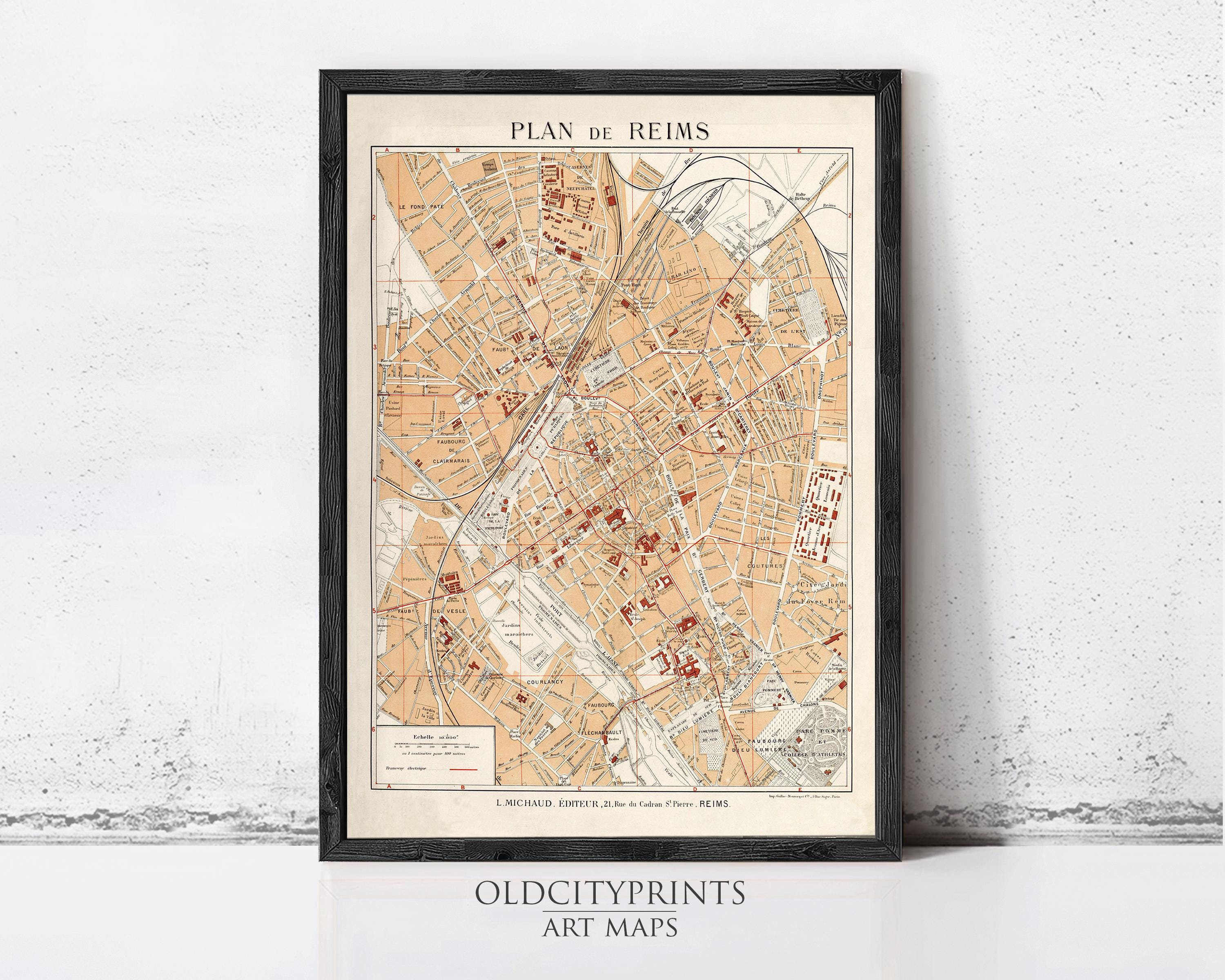 The image is a framed vintage map of Reims, France, depicting the city's streets and landmarks.