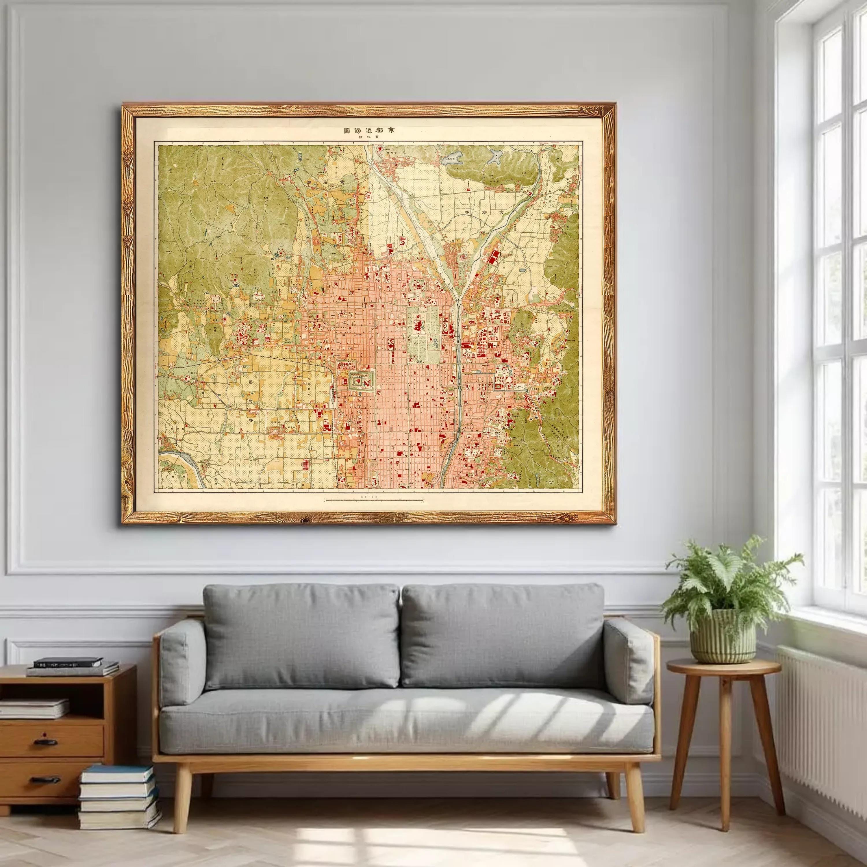 a large framed map hanging on a wall in a living room, with a gray sofa and a small table with a plant nearby.