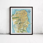 The image is a framed map of San Francisco, California, with a detailed and colorful depiction of the city's streets, landmarks, and surrounding areas.