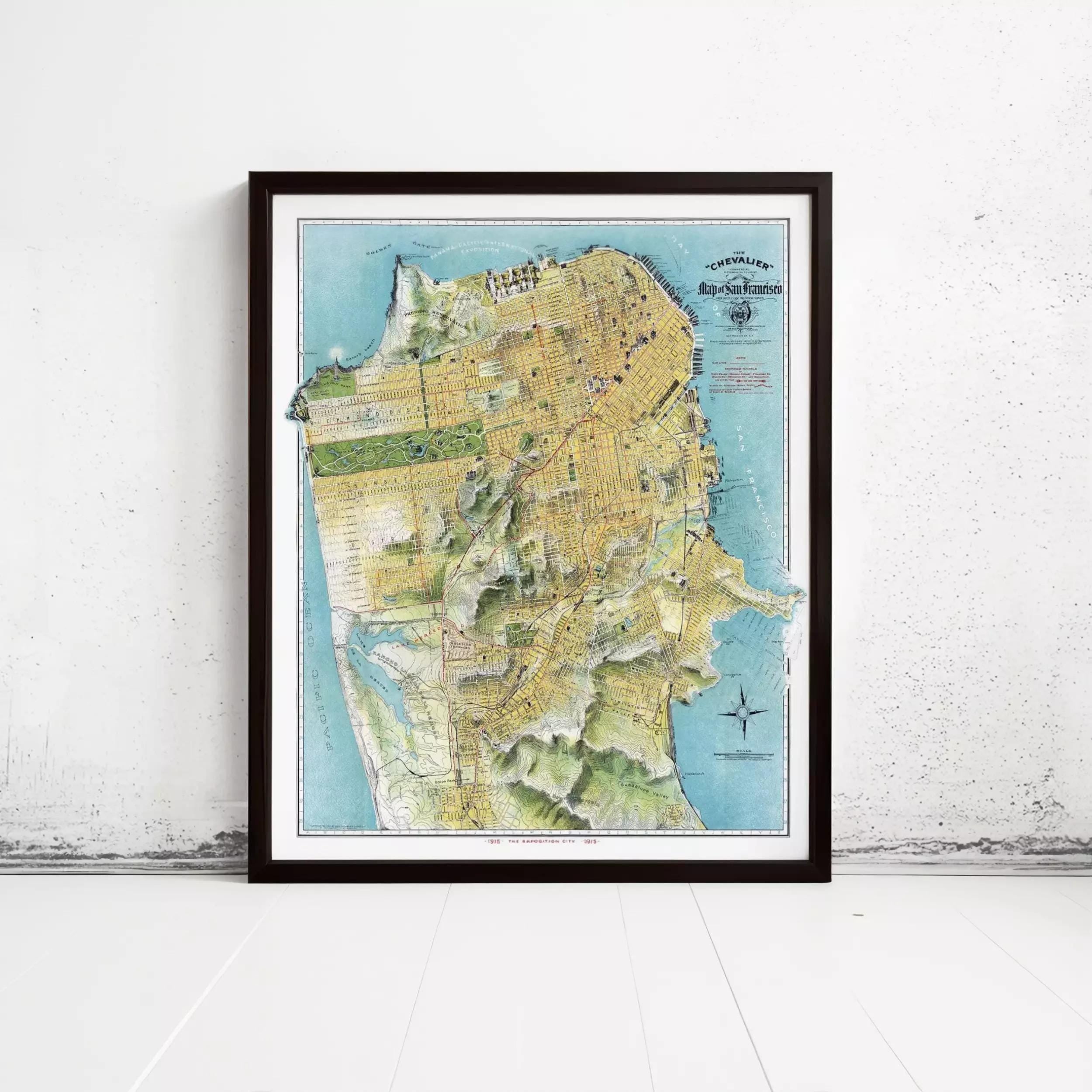 The image is a framed map of San Francisco, California, with a detailed and colorful depiction of the city's streets, landmarks, and surrounding areas.