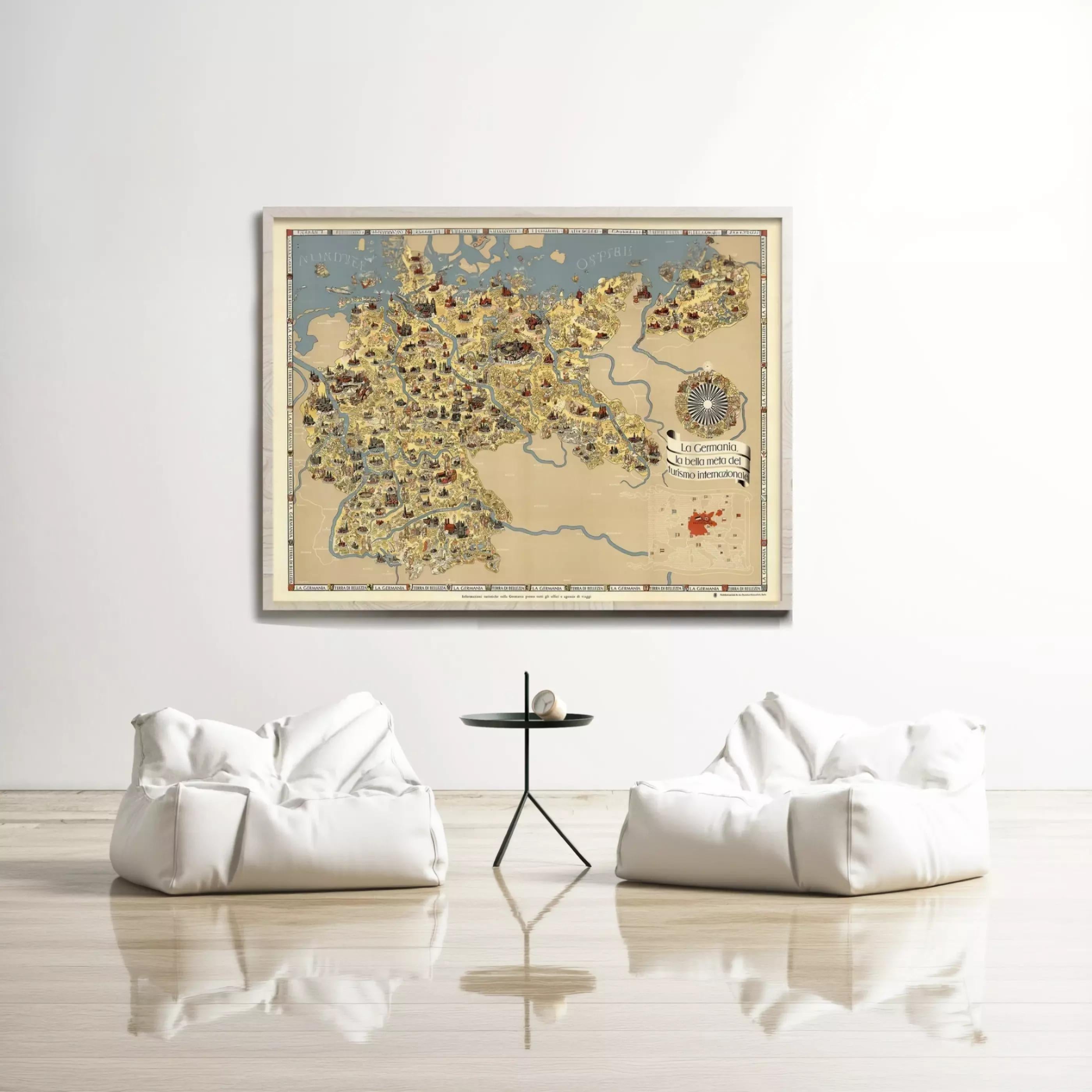 a large framed map of Europe hanging on a white wall, with two white bean bag chairs positioned in front of it.