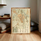 The image is a framed vintage map of a city, likely from the 19th century, with detailed geographical information and labels.
