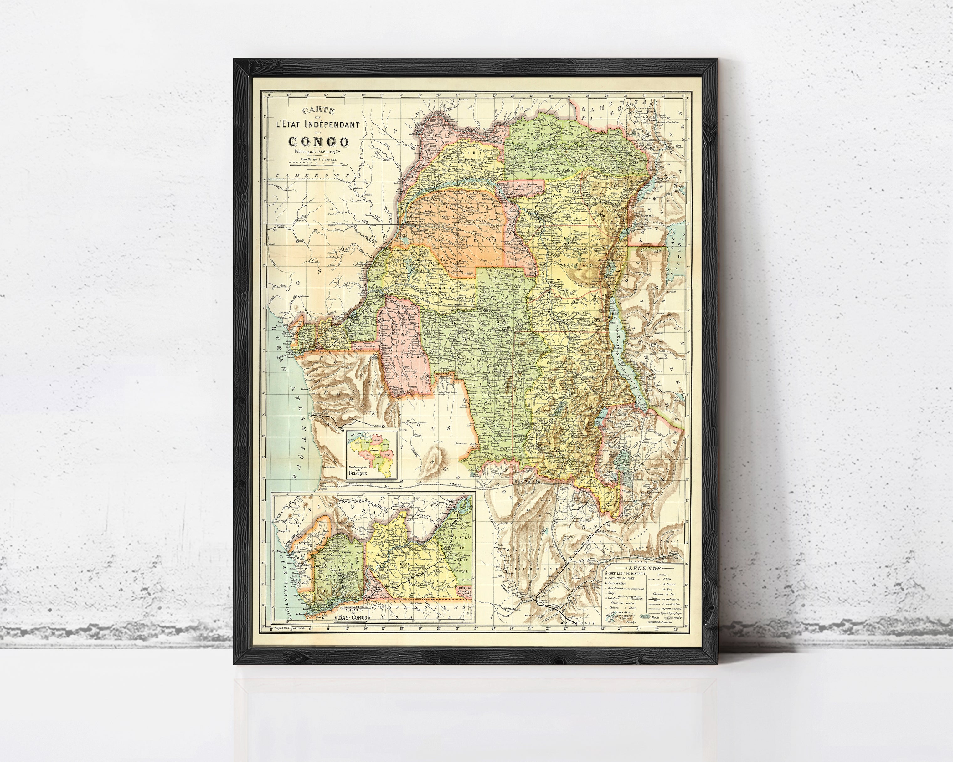 The image is a framed vintage map of the Congo, depicting the country's geographical layout and boundaries.