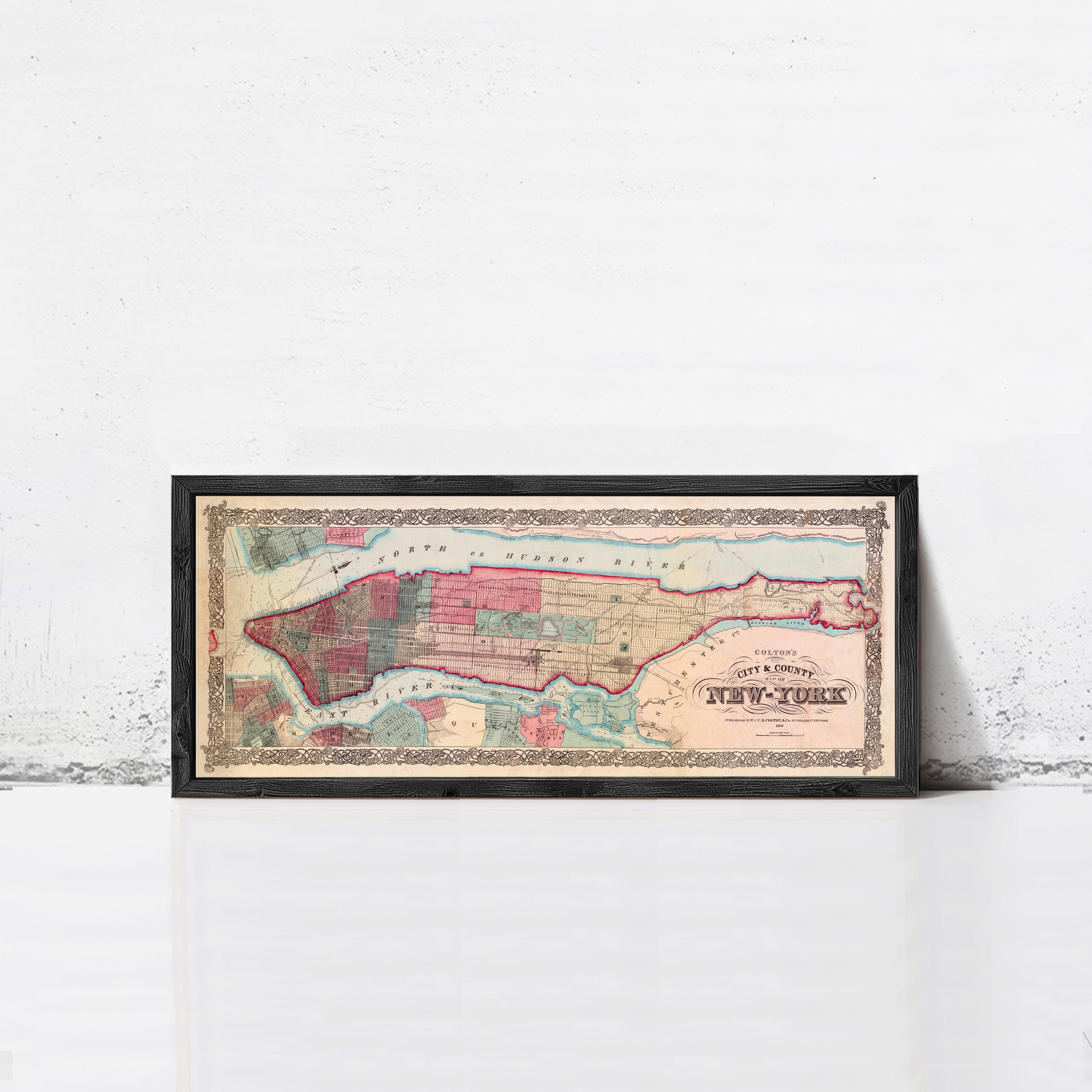 A framed map of New York City from the year 1848, depicting the city's layout and surrounding areas.