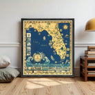 The image is a framed vintage map of Florida, depicting various landmarks and coastal areas in a stylized and decorative manner.