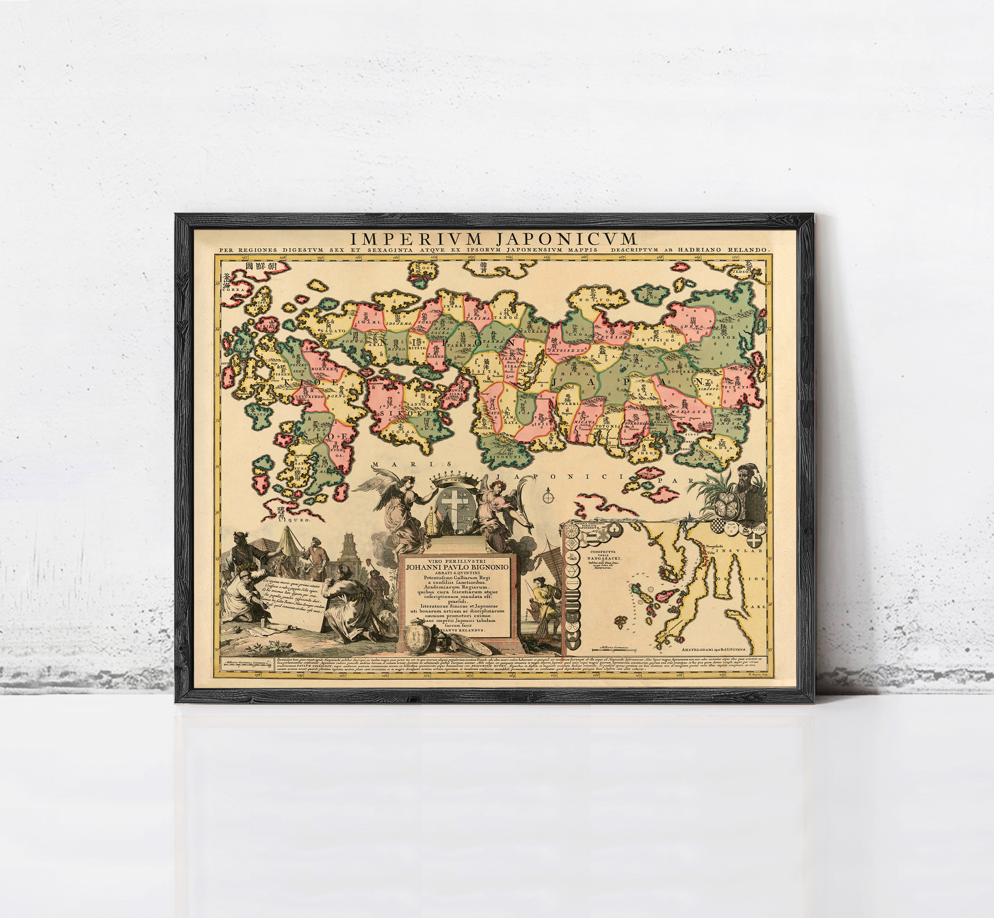 The image is a framed vintage map of the world, depicting various regions and countries with different colors and symbols.