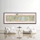 a large framed map of Central Park hanging on a wall, with two white bean bag chairs positioned in front of it.