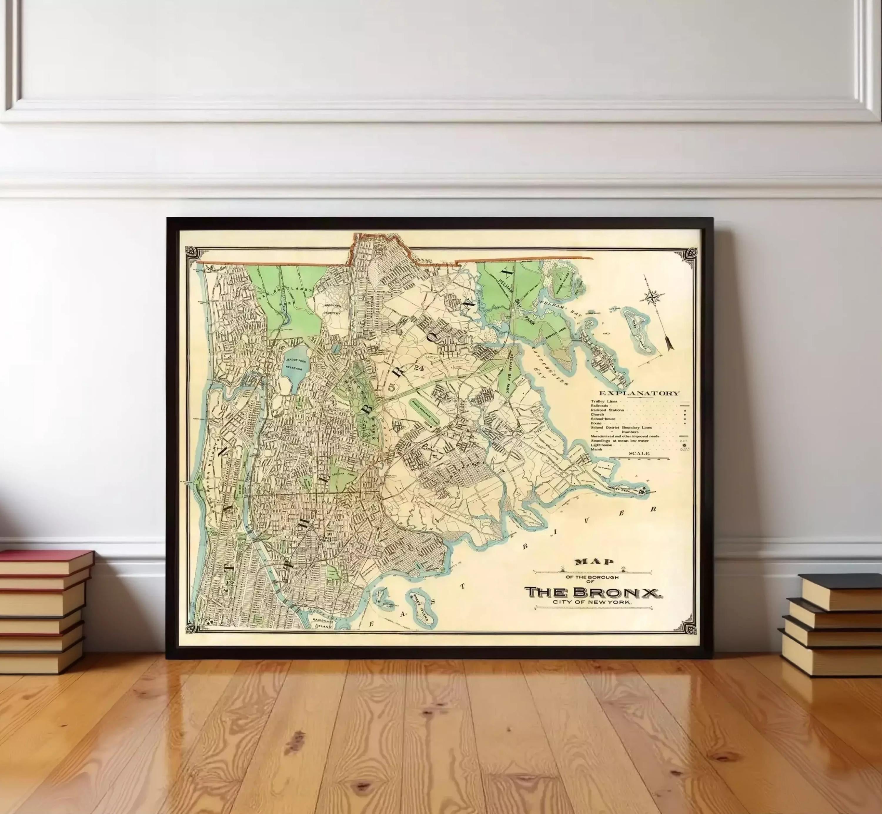 a framed map of the Bronx, New York, with a wooden floor in the foreground.