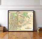 a framed map of the Bronx, New York, with a wooden floor in the foreground.