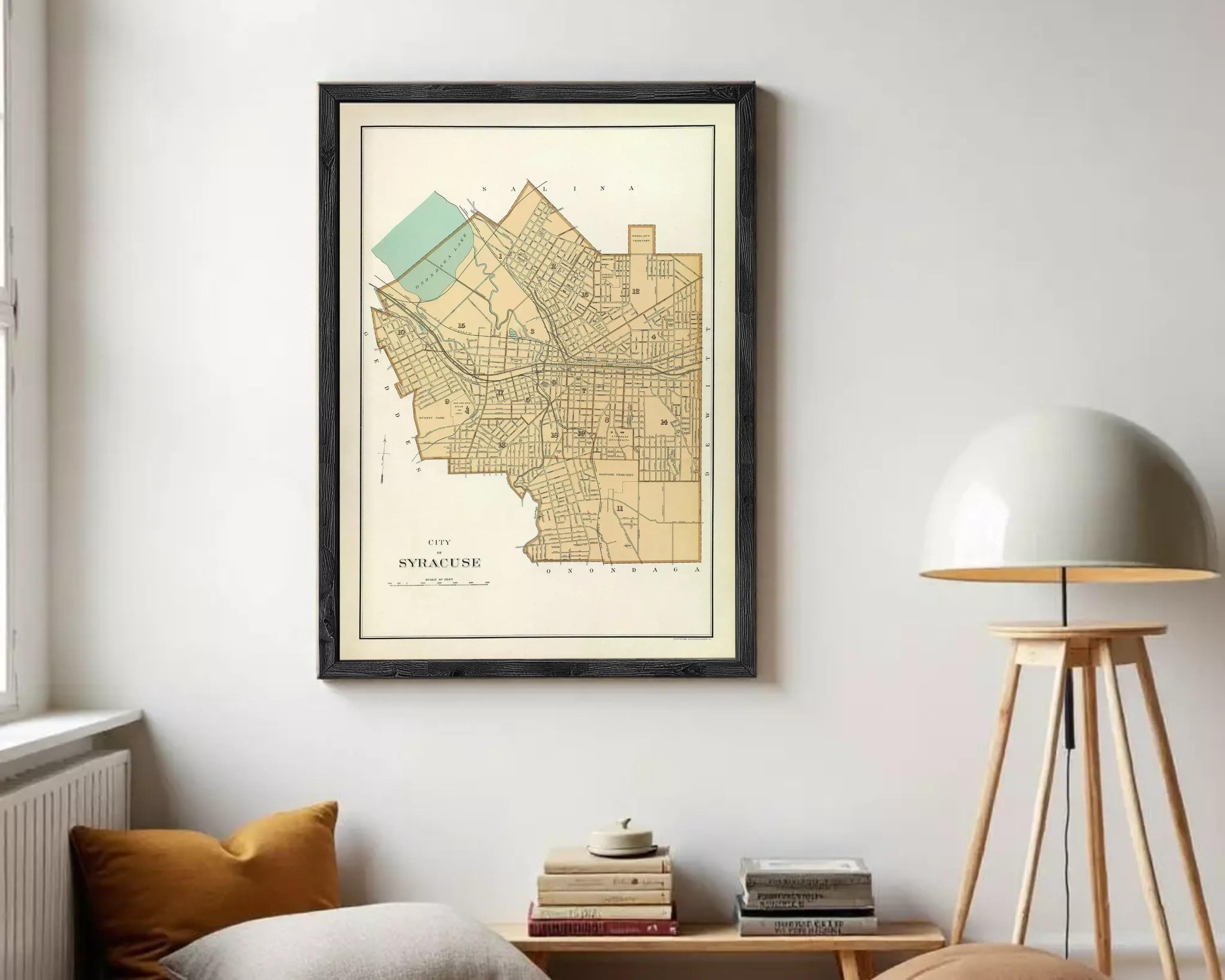 A framed map of the city of Syracuse, New York, with a vintage style and a light brown color scheme.