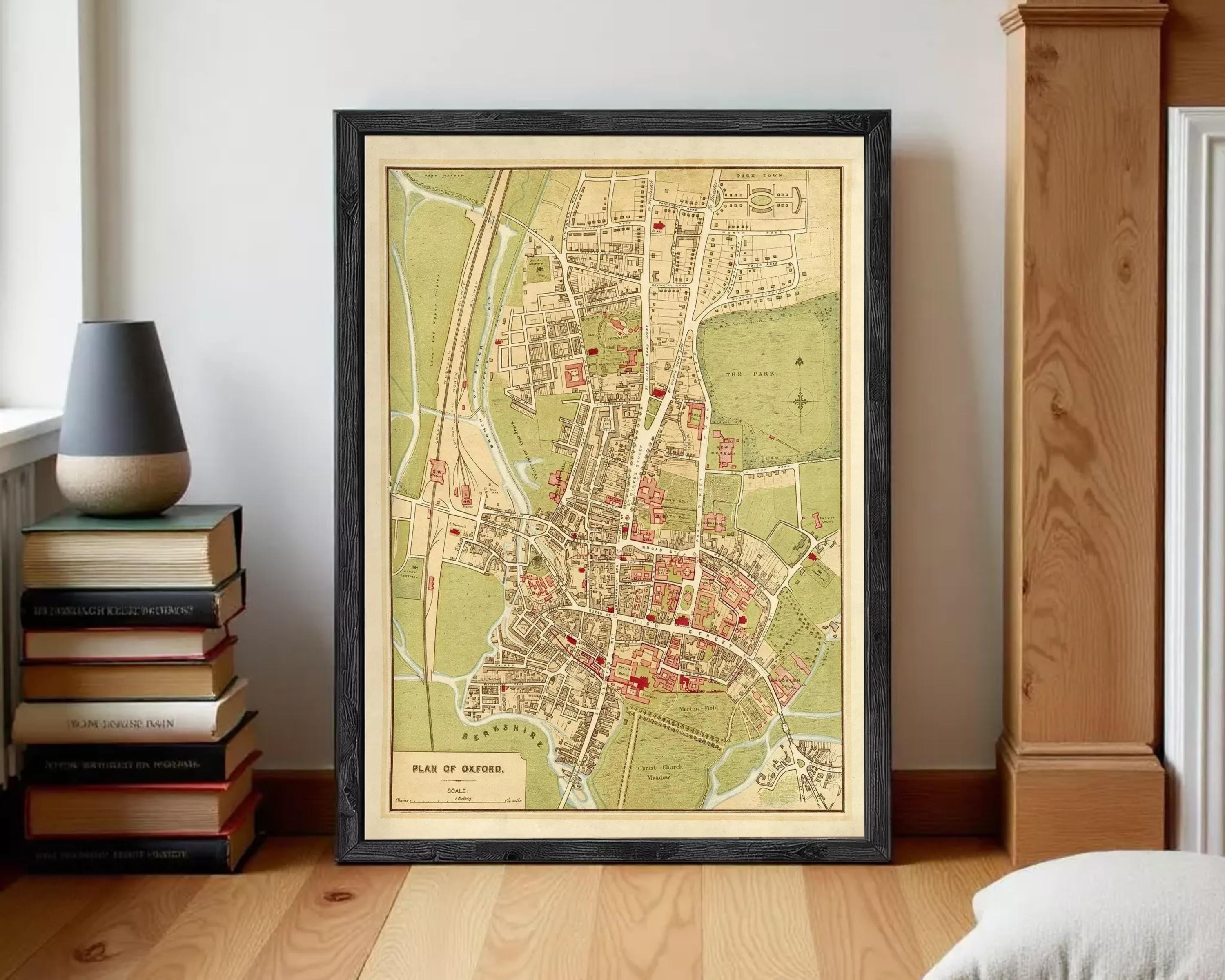 The image is a framed vintage map of Oxford, England, depicting the city's layout and surrounding areas.