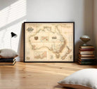 The image is a framed vintage map of Australia and New Zealand, depicting the geographical layout and boundaries of the countries in a sepia-toned style.
