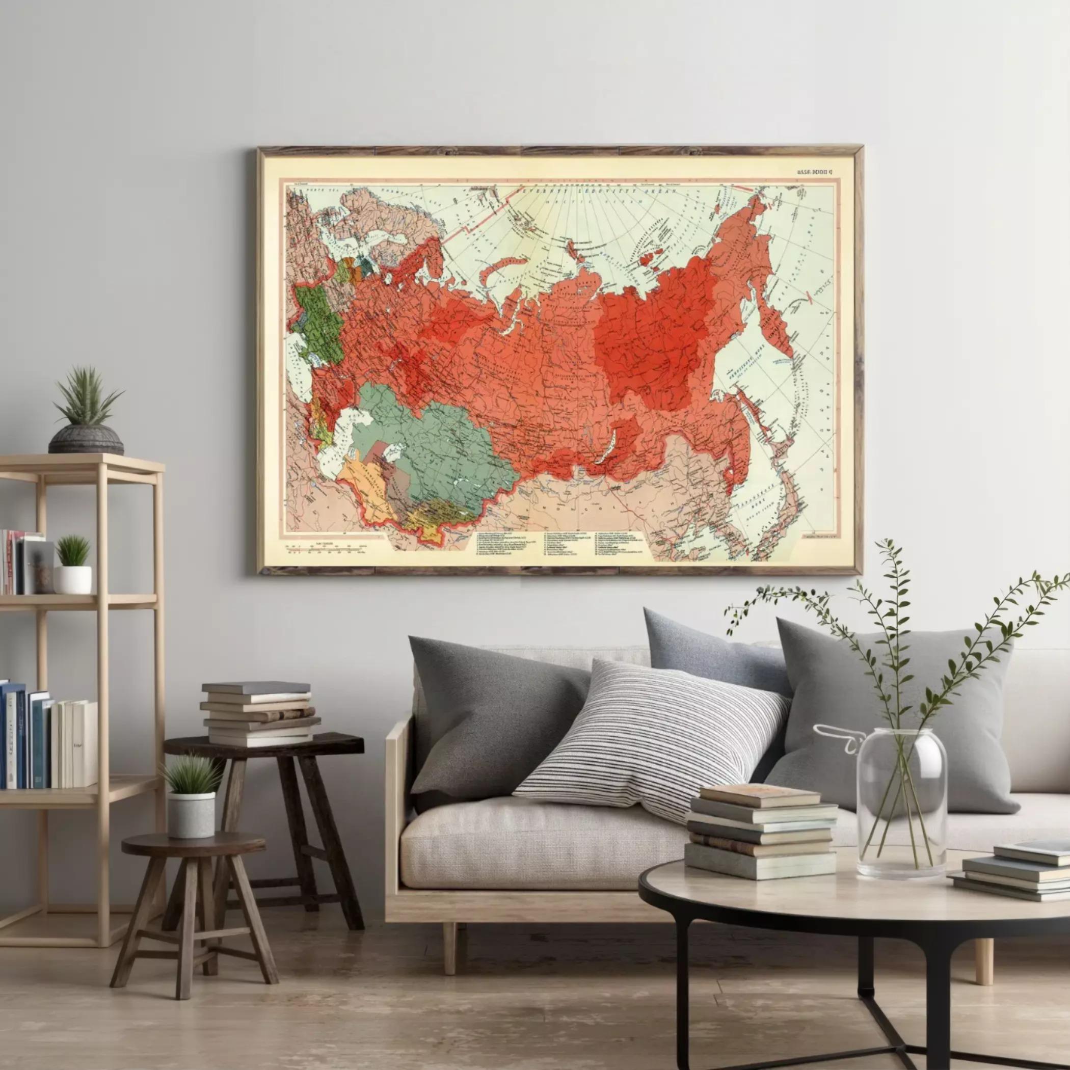 a large framed map of the world hanging on a wall in a living room setting.