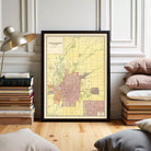 The image is a framed map of Indianapolis, Indiana, showing the city's streets and surrounding areas.