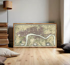 A framed map of London, England, with a river running through the city.