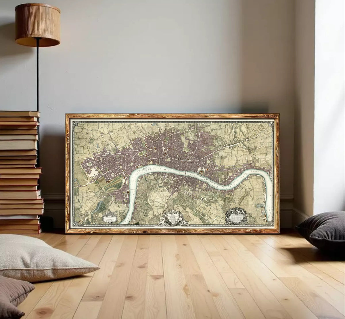 A framed map of London, England, with a river running through the city.