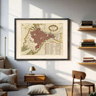 The image is a framed vintage map of a city, likely from the 16th century, depicting a detailed layout of the city's streets and surrounding areas.