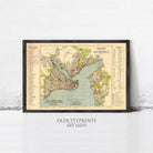 The image is a framed vintage map of a city, likely from the early 20th century, with detailed street names and labels.