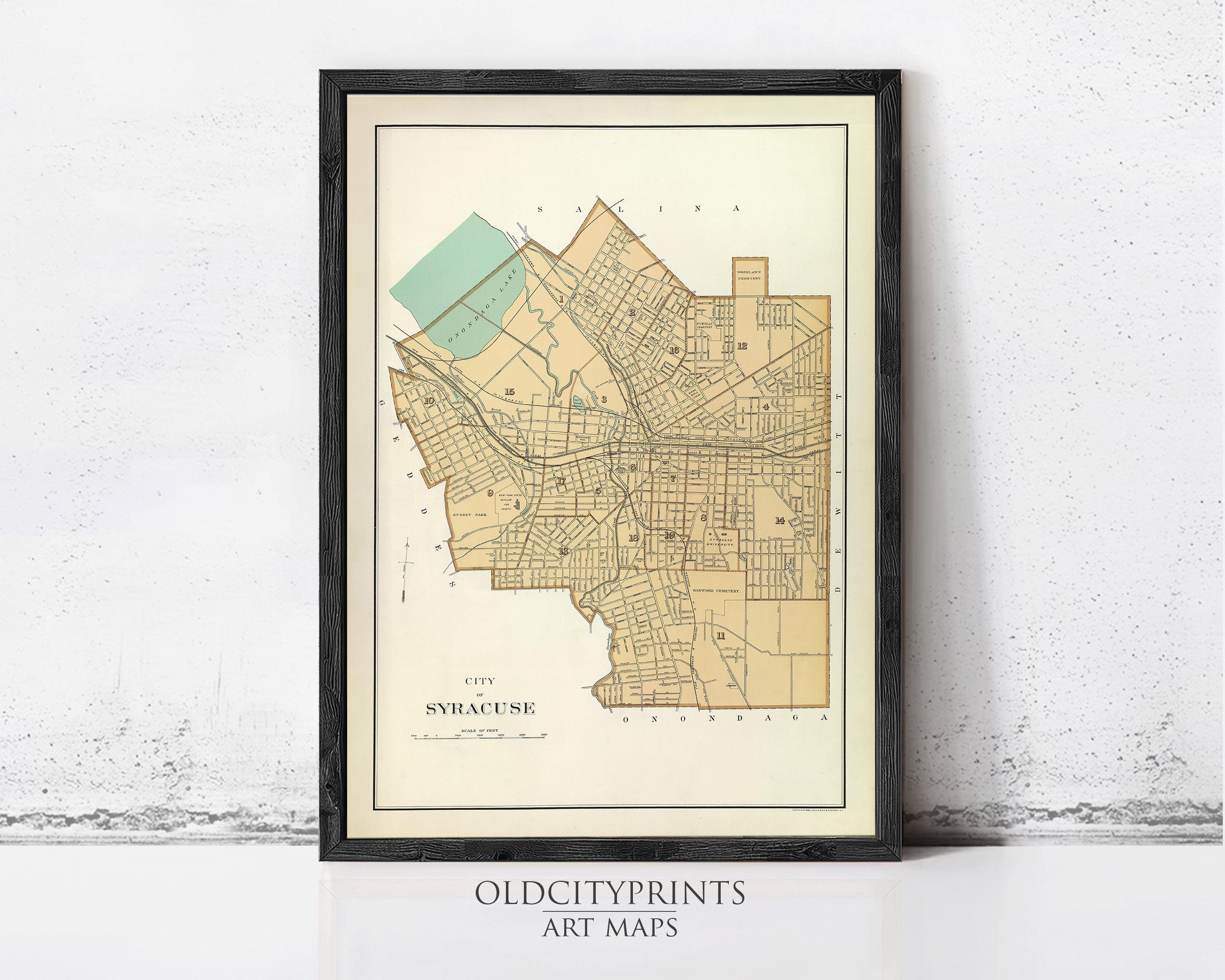The image is a framed vintage map of the city of Syracuse, New York, with a black border and a cream background.