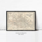 The image is a framed vintage map of a city, likely Dublin, with detailed street and area labels.