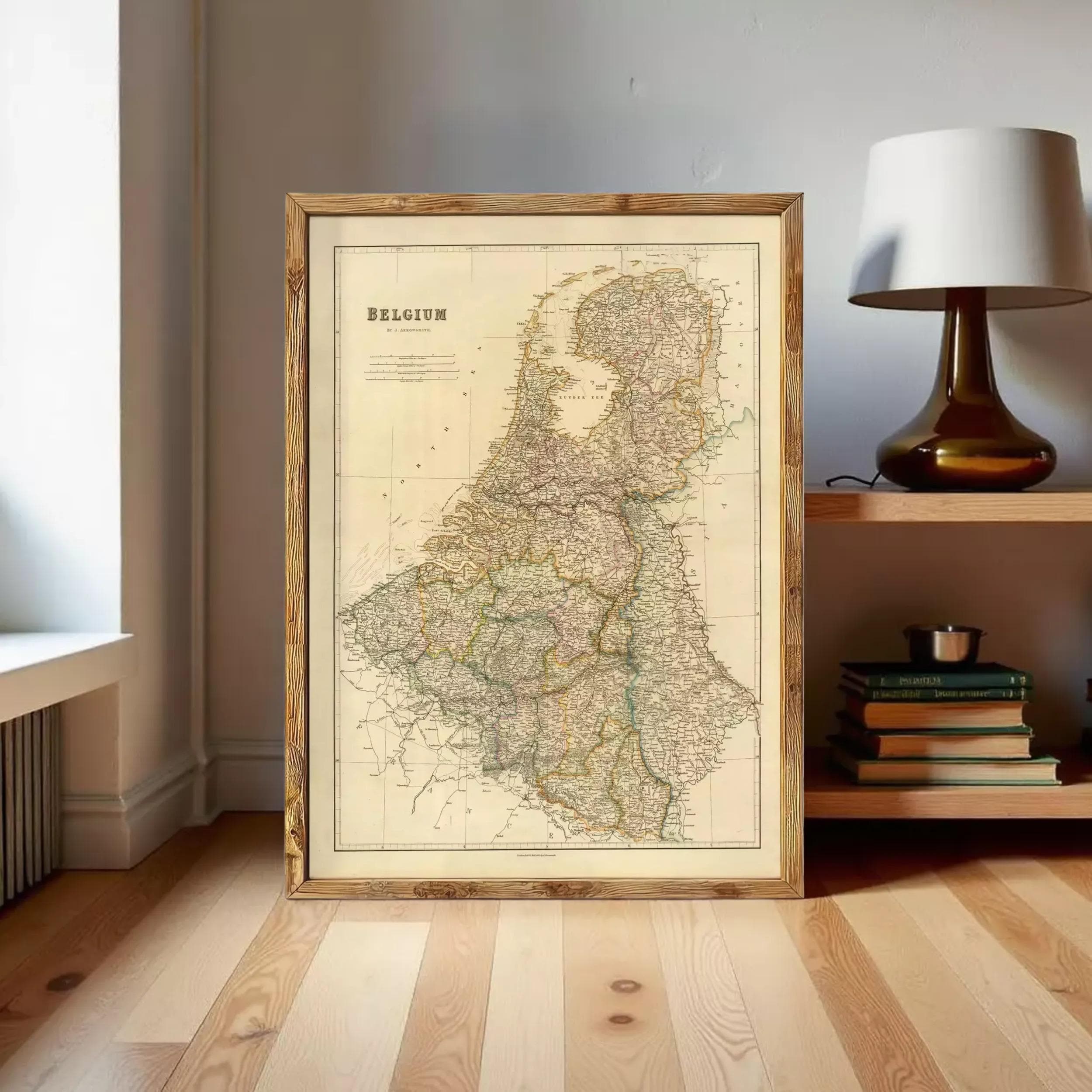 a large framed map of Belgium, with a lamp and bookshelf visible in the background.
