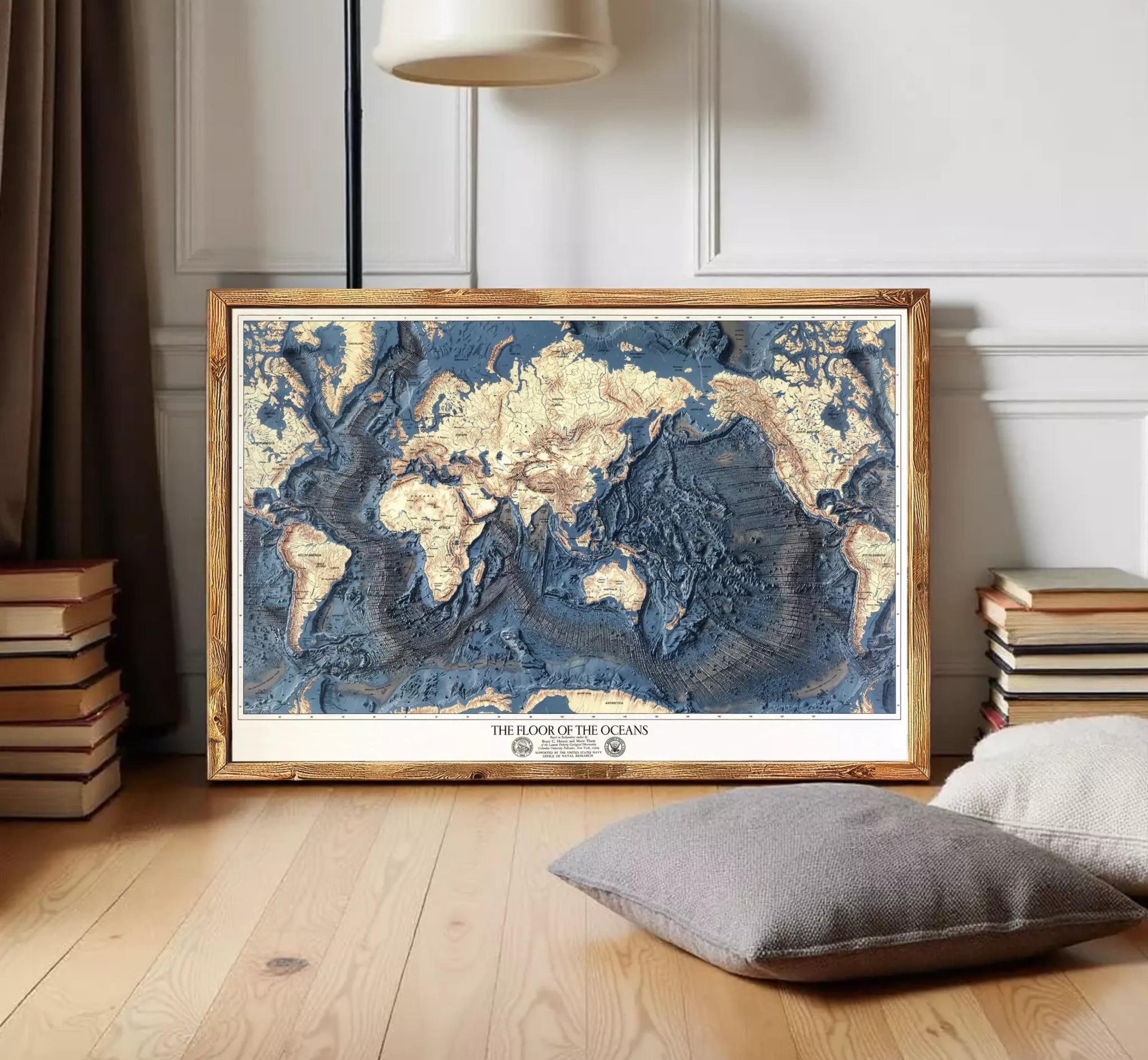 The image is a framed map of the world, specifically depicting the floor of the oceans.
