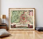 The image is a framed vintage map of a city, depicting a detailed layout of the streets, landmarks, and surrounding areas.