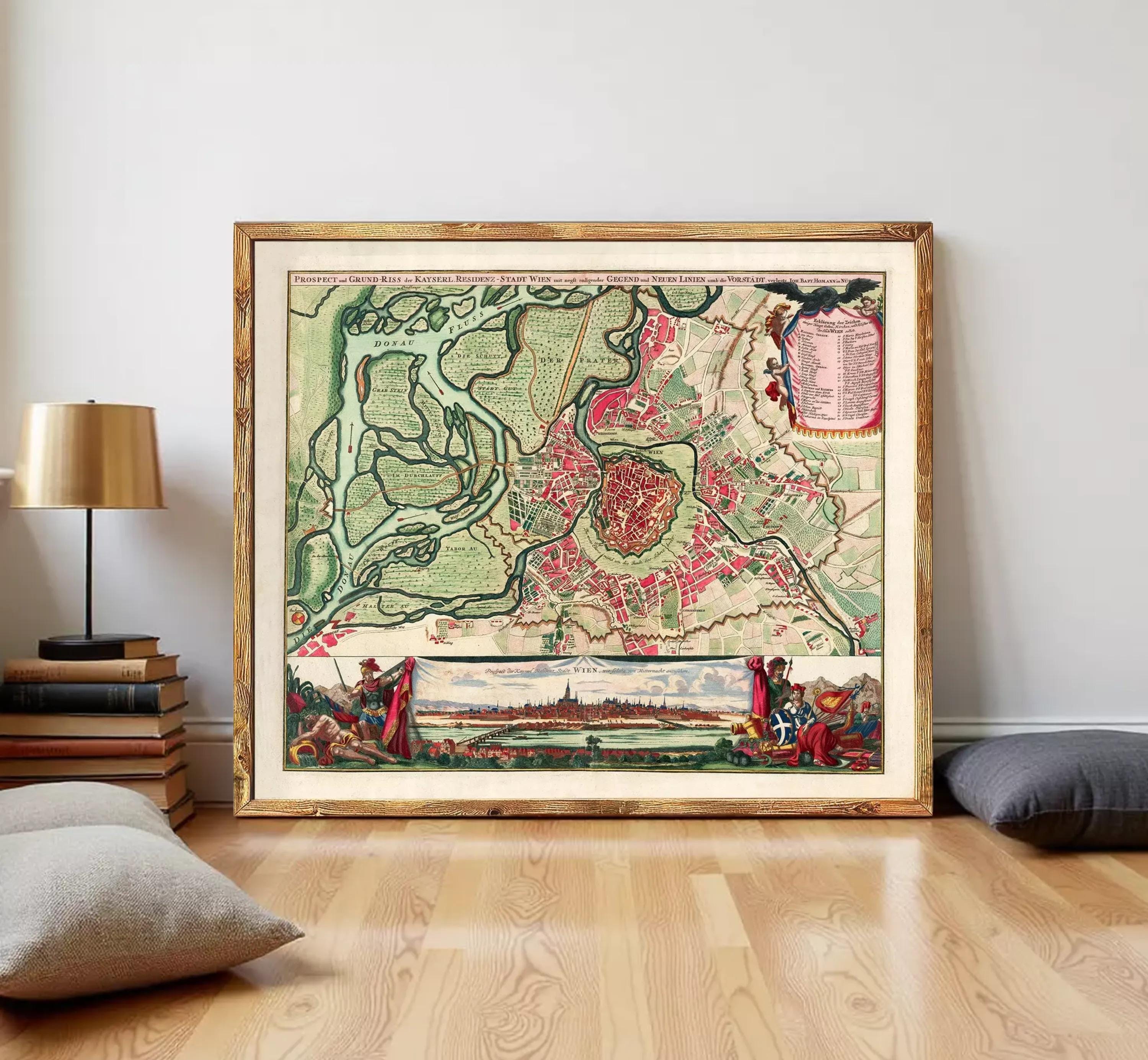 The image is a framed vintage map of a city, depicting a detailed layout of the streets, landmarks, and surrounding areas.