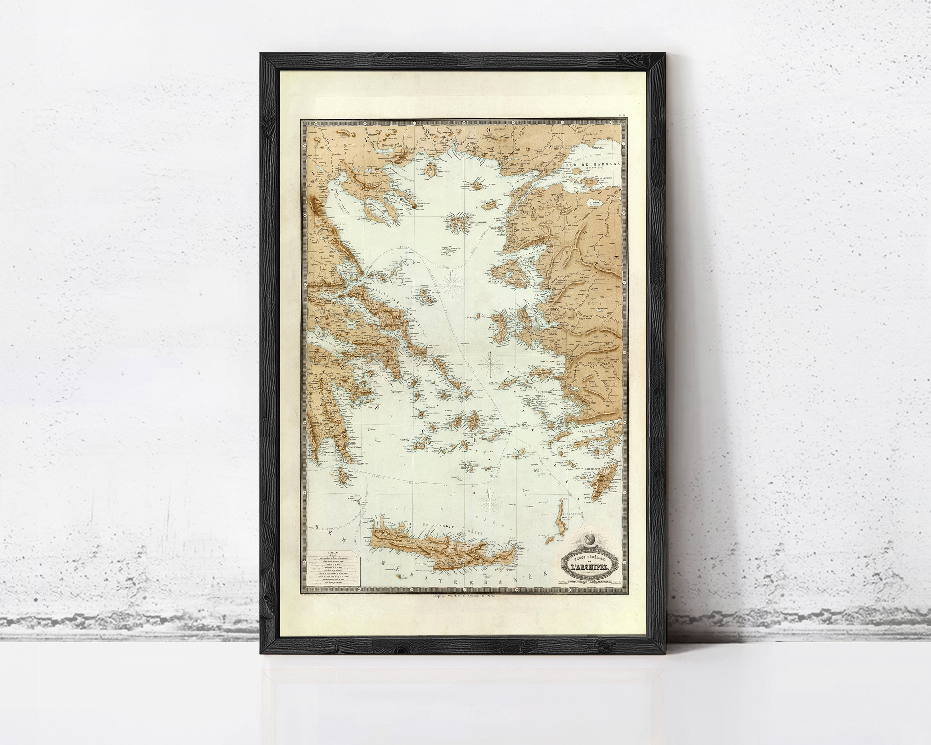 The image is a framed map of Greece, depicting the country's geographical layout and surrounding areas.