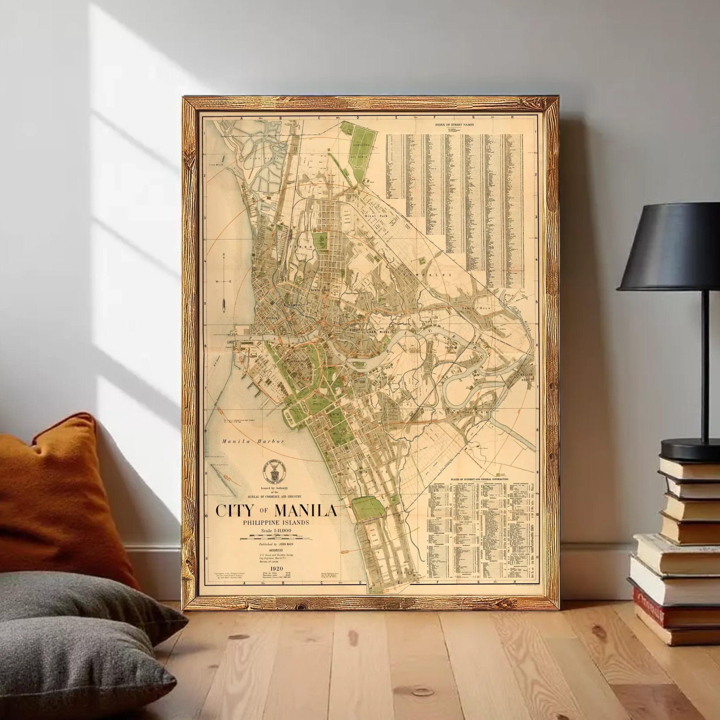 The image is a framed vintage map of Manila, Philippines, depicting the city's layout and surrounding areas.