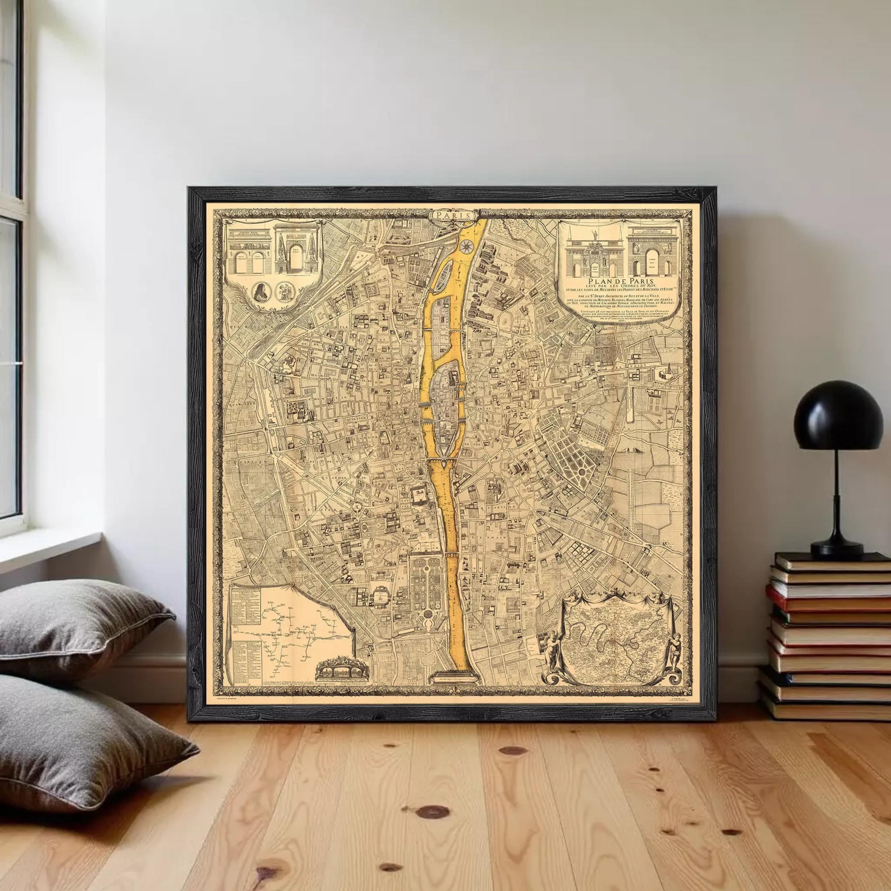 The image is a framed vintage map of a city, depicting a detailed layout of streets, buildings, and other urban features.