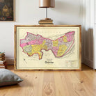 The image is a framed map of Cambridge, England, showing the city's streets and surrounding areas.
