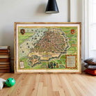 a large framed map of a city, with various landmarks and streets depicted.