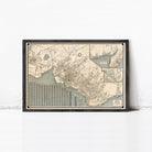 The image is a framed vintage map of a city, depicting various streets, landmarks, and bodies of water.