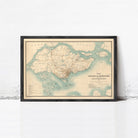 The image is a framed vintage map of Singapore, depicting the island's geographical layout and surrounding areas.