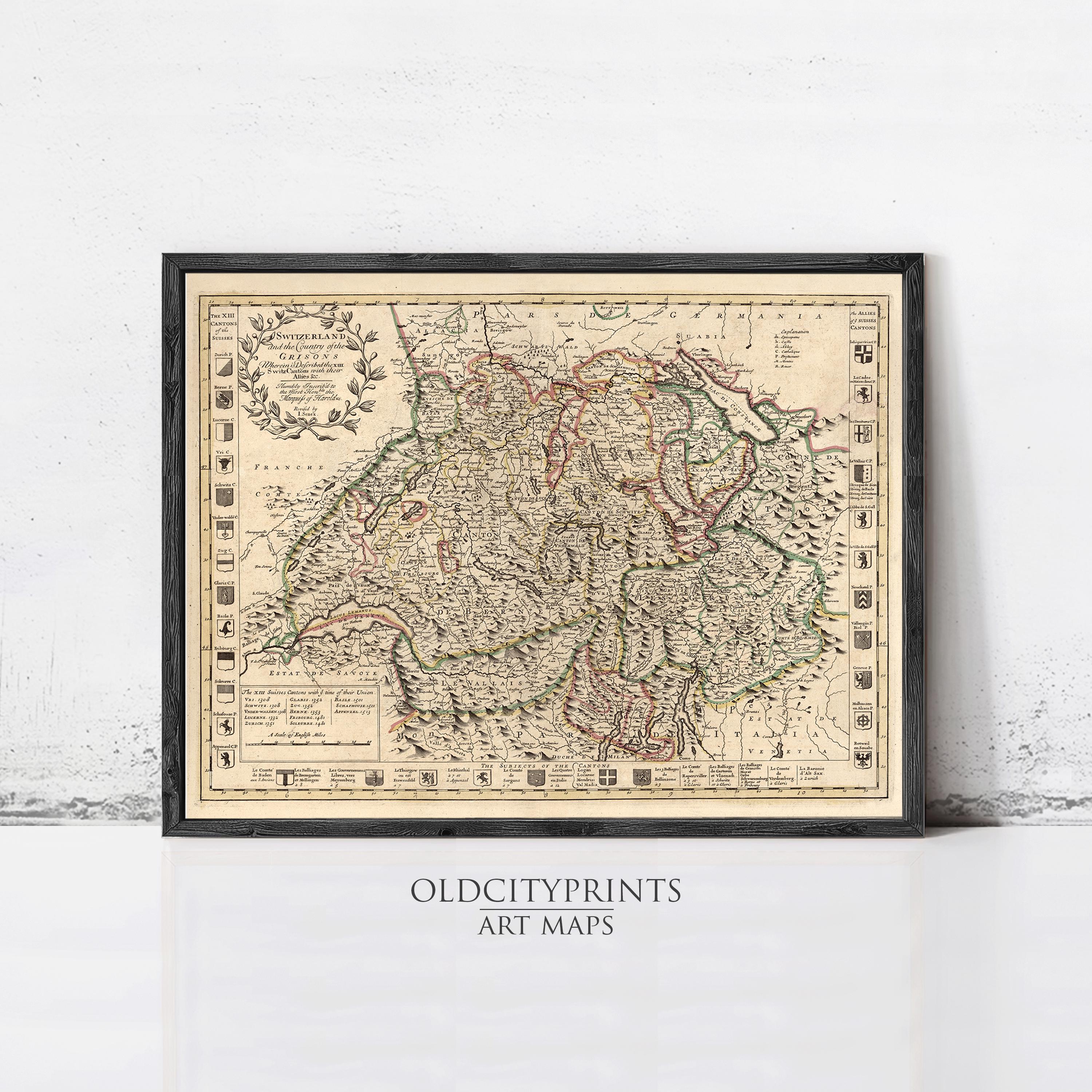 The image is a framed vintage map of Europe, likely from the 16th century, displayed on a white wall.