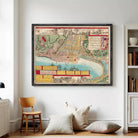 The image is a framed vintage map of a city, depicting various landmarks and geographical features.