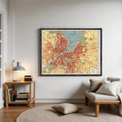 The image is a framed vintage map of a city, likely from the early 20th century, depicting the city's layout and surrounding areas.