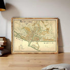 A framed map of Manila, Philippines, displayed on a wall.