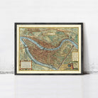 The image is a framed vintage map of a city, likely Paris, with detailed illustrations and labels.