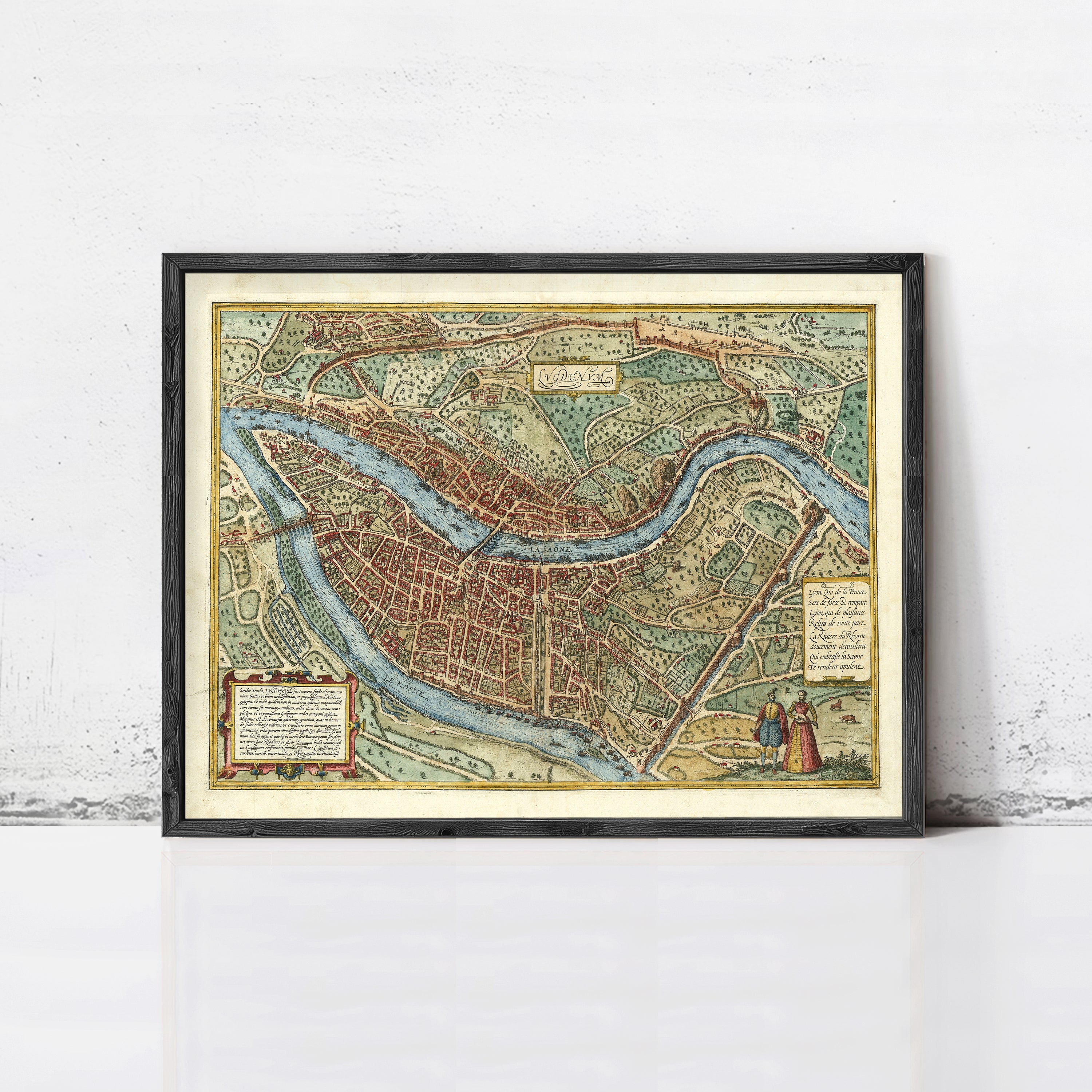 The image is a framed vintage map of a city, likely Paris, with detailed illustrations and labels.