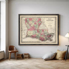 The image is a framed vintage map of Louisiana, depicting the state in a detailed and colorful manner.