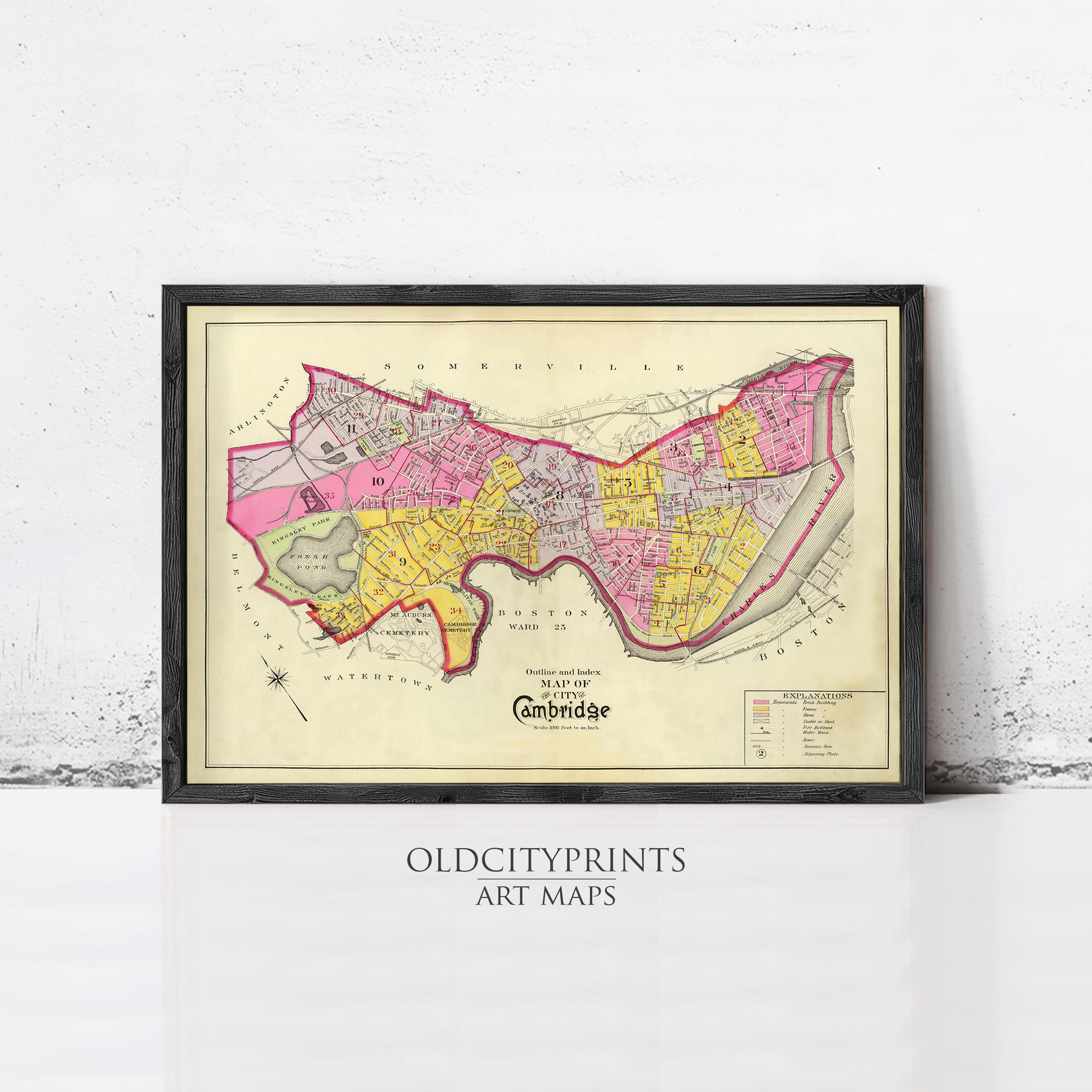 The image is a framed vintage map of Cambridge, Massachusetts, with a black border and a beige background.