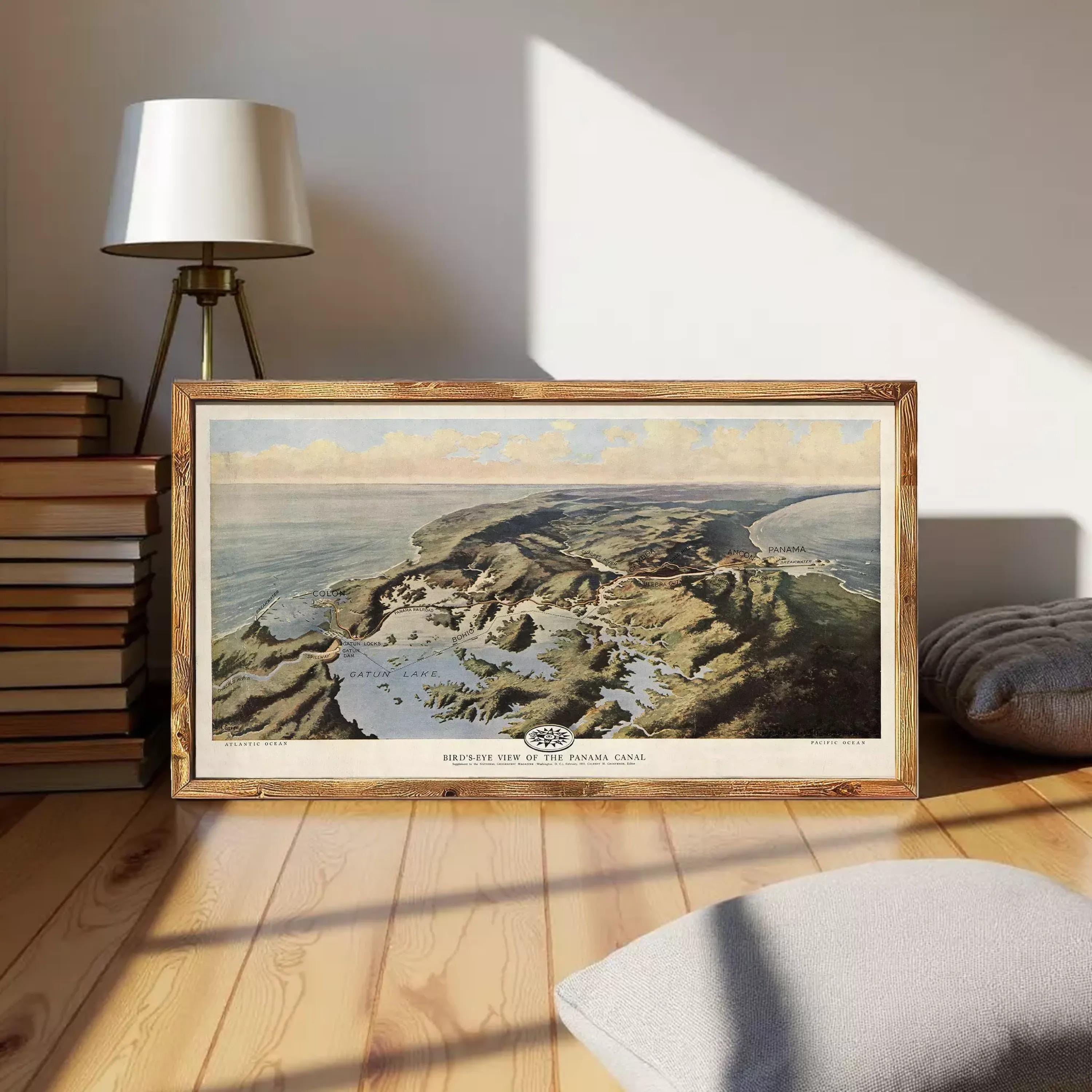 The image is a framed painting depicting a coastal landscape with mountains, water, and clouds in the background.
